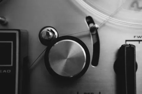 close up of a reel to reel tape machine spool