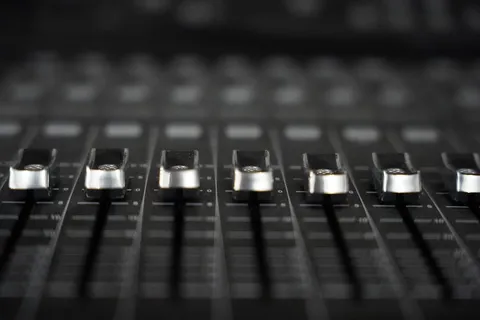 Close-up of an analog audio fader or knob with shallow depth of field