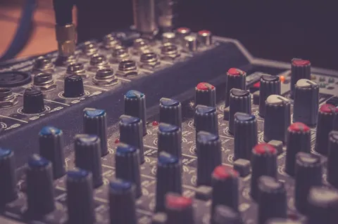 close-up of mixer knobs at low light